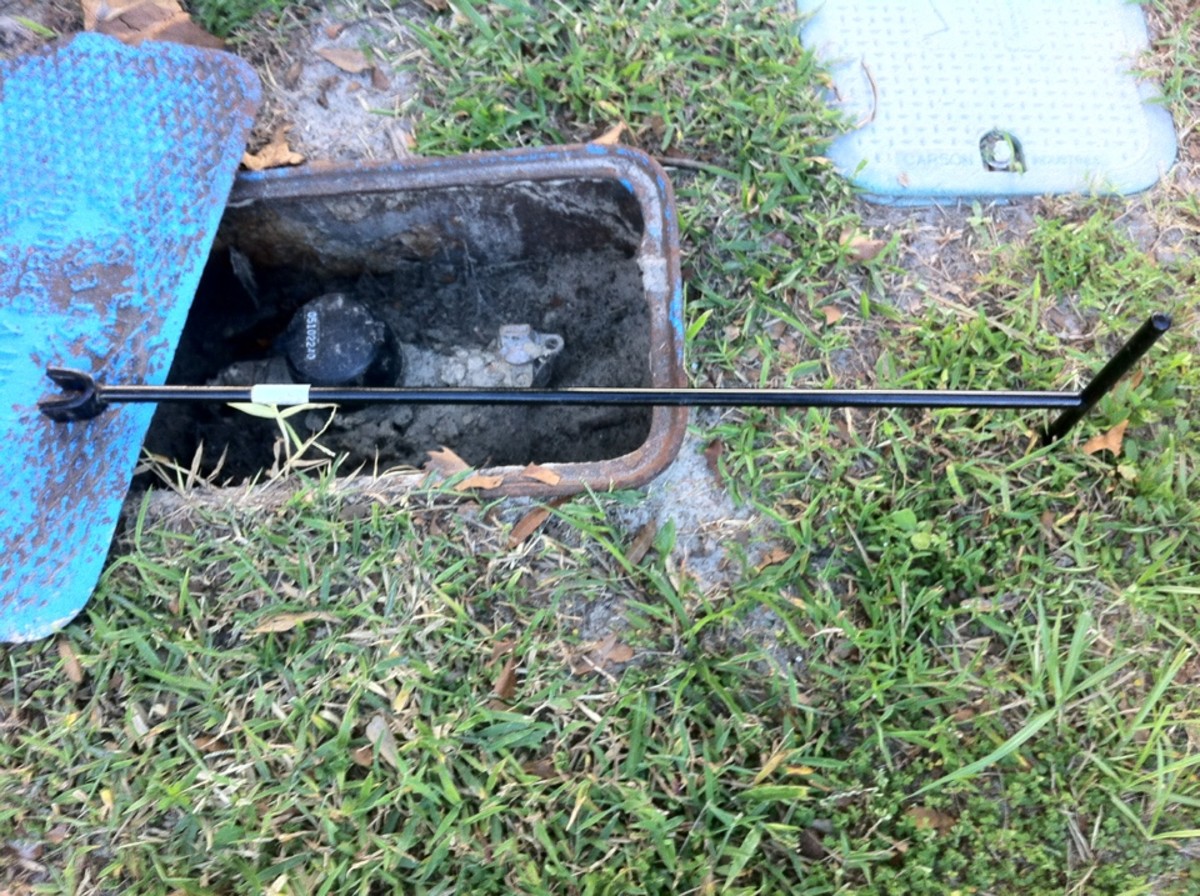 A curb key turns the water meter's valve.