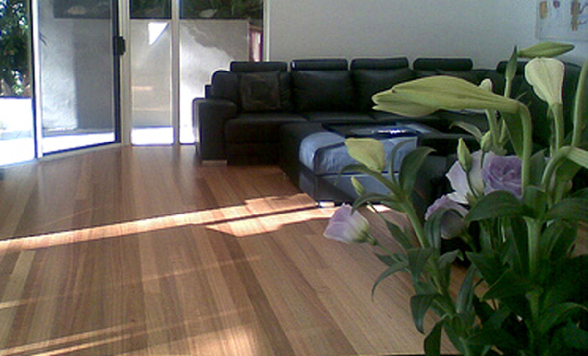 Choose wood laminate or vinyl cork over wood floors for sheer durability.