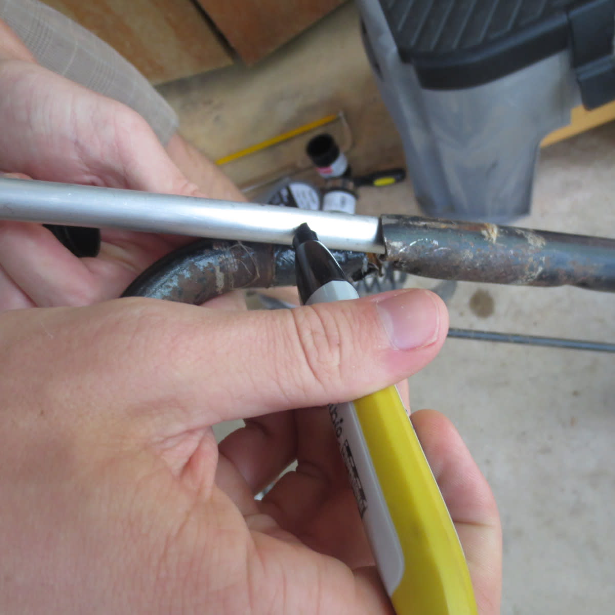 Once the rod is in as far as it will go, mark your cut area 3-4 inches past the break into the upper part of the handle. (Fig. 4)