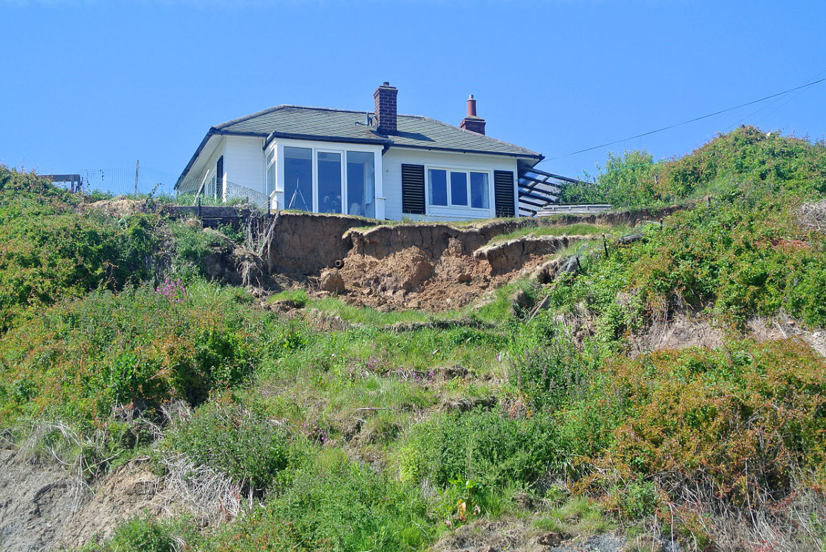 Erosion can undermine a foundation. This is common on hillsides, sandy soil, and areas with poor drainage control.
