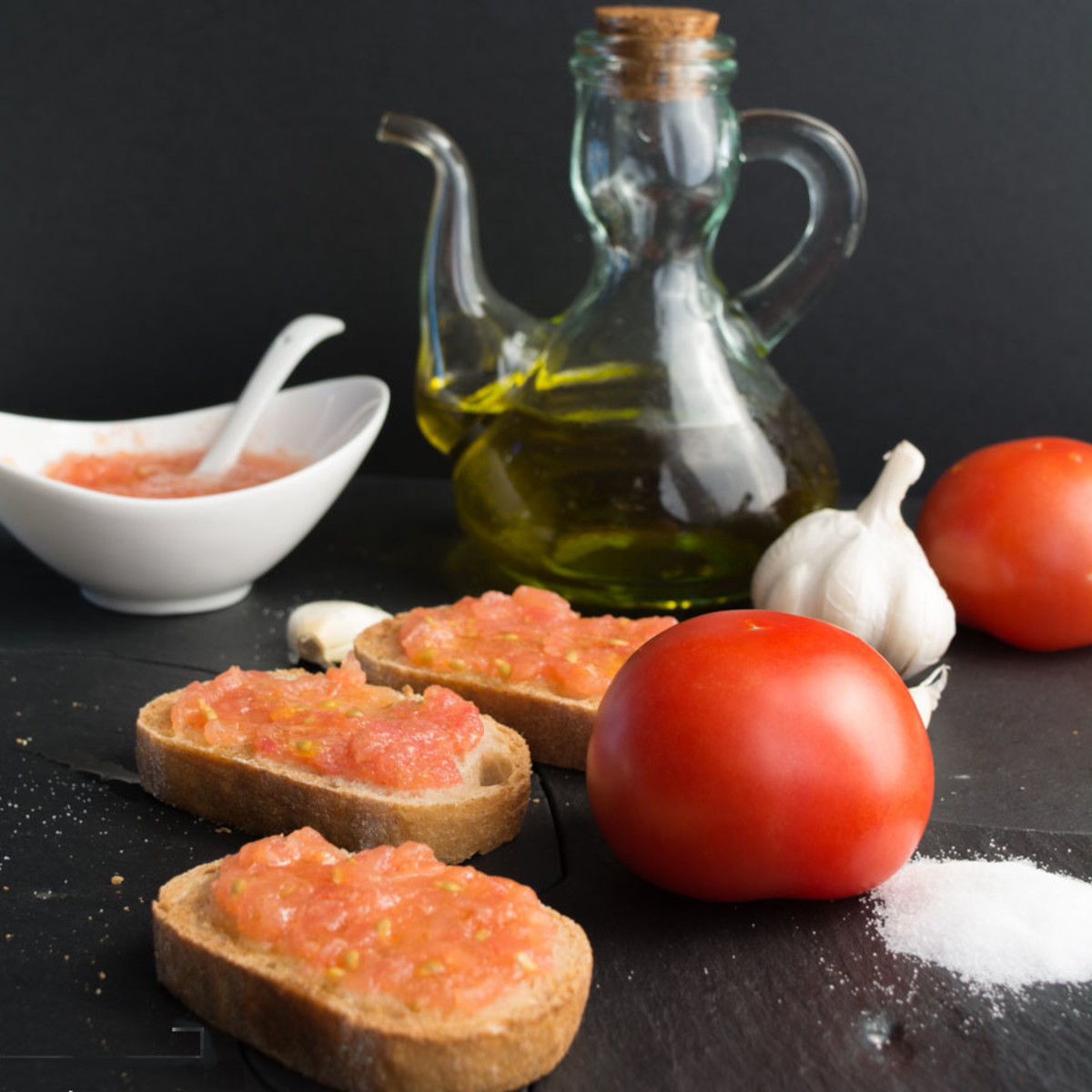 Traditional Spanish breakfast: a slice of bread rubbed with a clove of raw garlic and squashed tomatoes on top.
