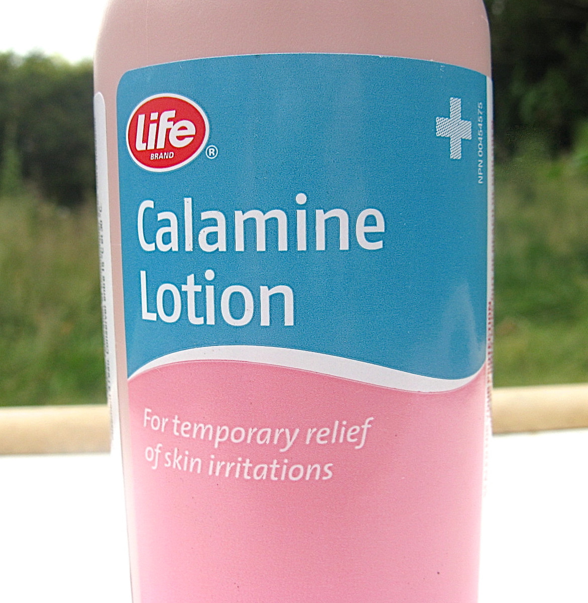 Calamine lotion is a pink liquid and often comes in a pink bottle.