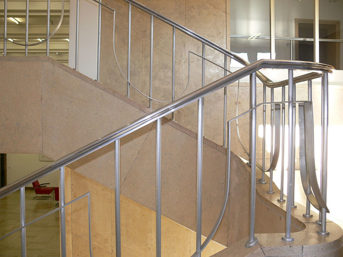 A staircase with metal handrails
