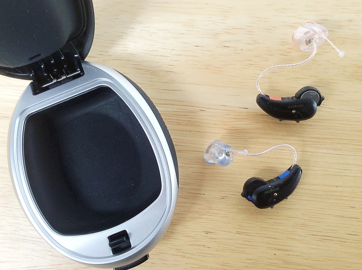 In this photo of my hearing aids, the battery compartments are open. This is how the aids are turned off.