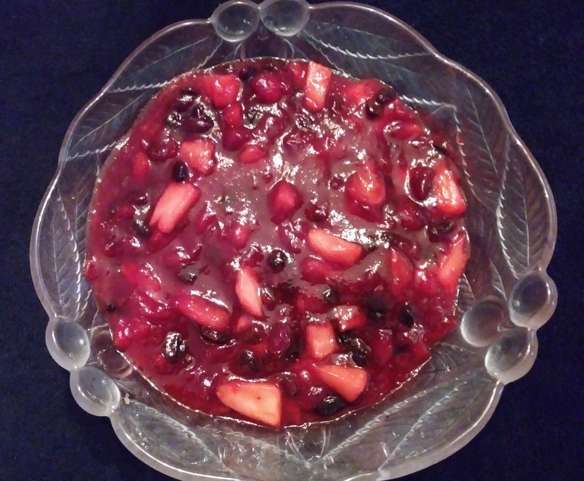 Cranberry-apple sauce with raisins and maple syrup. Serve the cranberry-apple sauce in a pretty glass bowl.