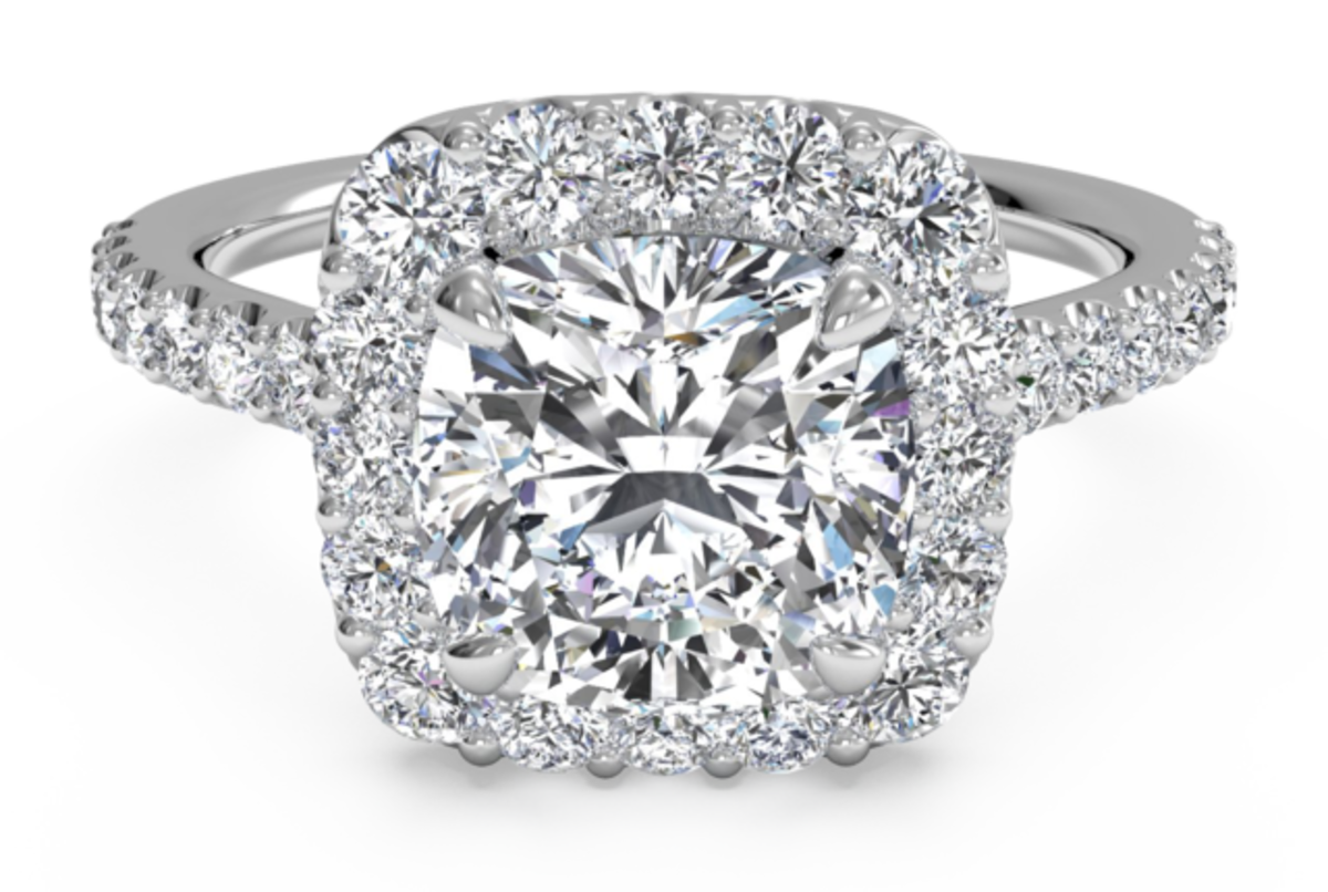 A halo-style engagement ring. Avoid them!