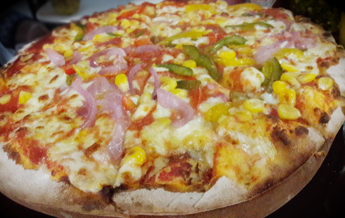 The pizza dough in a topped pizza.