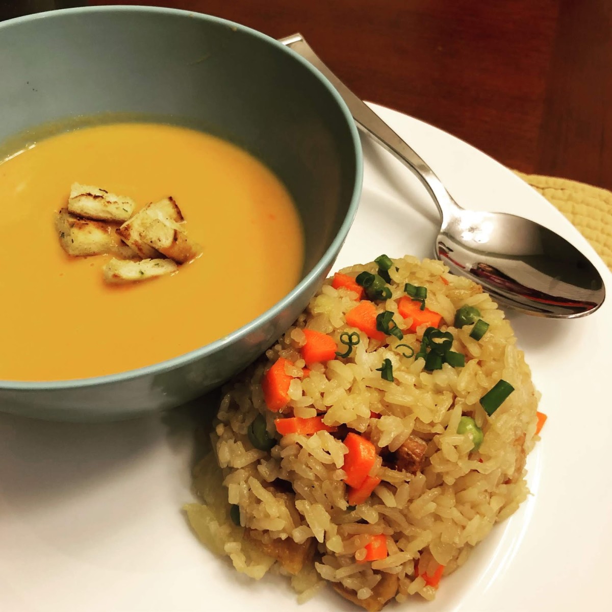 Egg-free veggie fried rice pictured with a butternut squash soup.