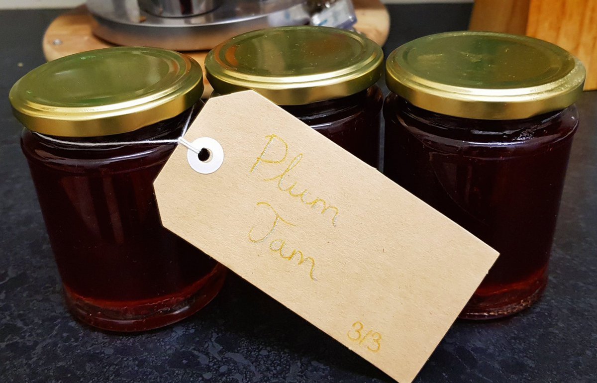 Some of the jars of plum jam that I made with my latest batch, labelled.