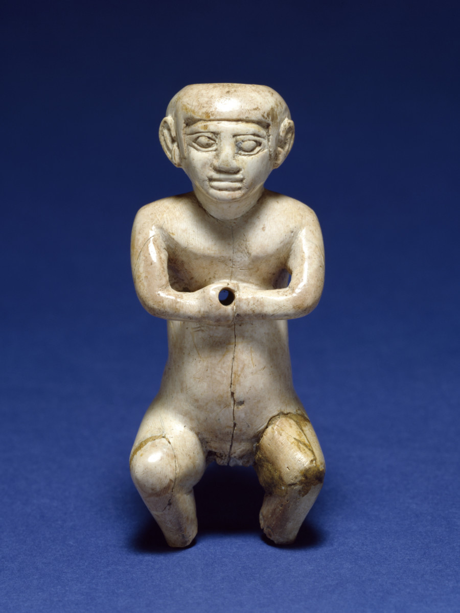 Dwarfs in ancient Egypt. A figurine of a male dwarf made out of hippopotamus ivory. (late Old Kingdom approx. 2200)