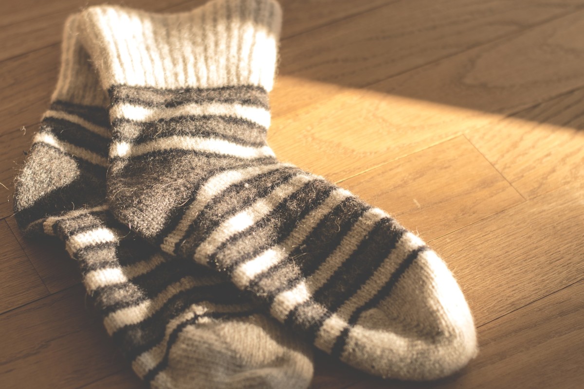 Warm socks can be a cozy way to get back to sleep.