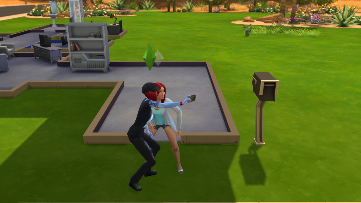 Two sims taking a selfie in "The Sims 4."