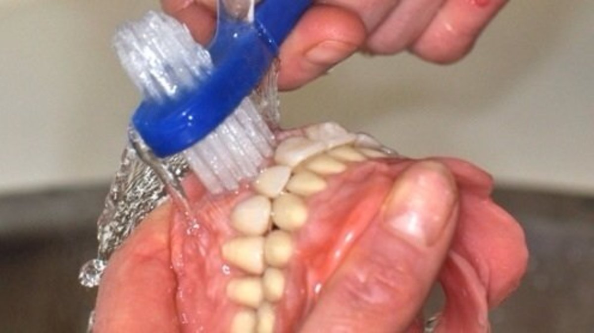 Brushing your denture, hold on tightly so you don't drop them!