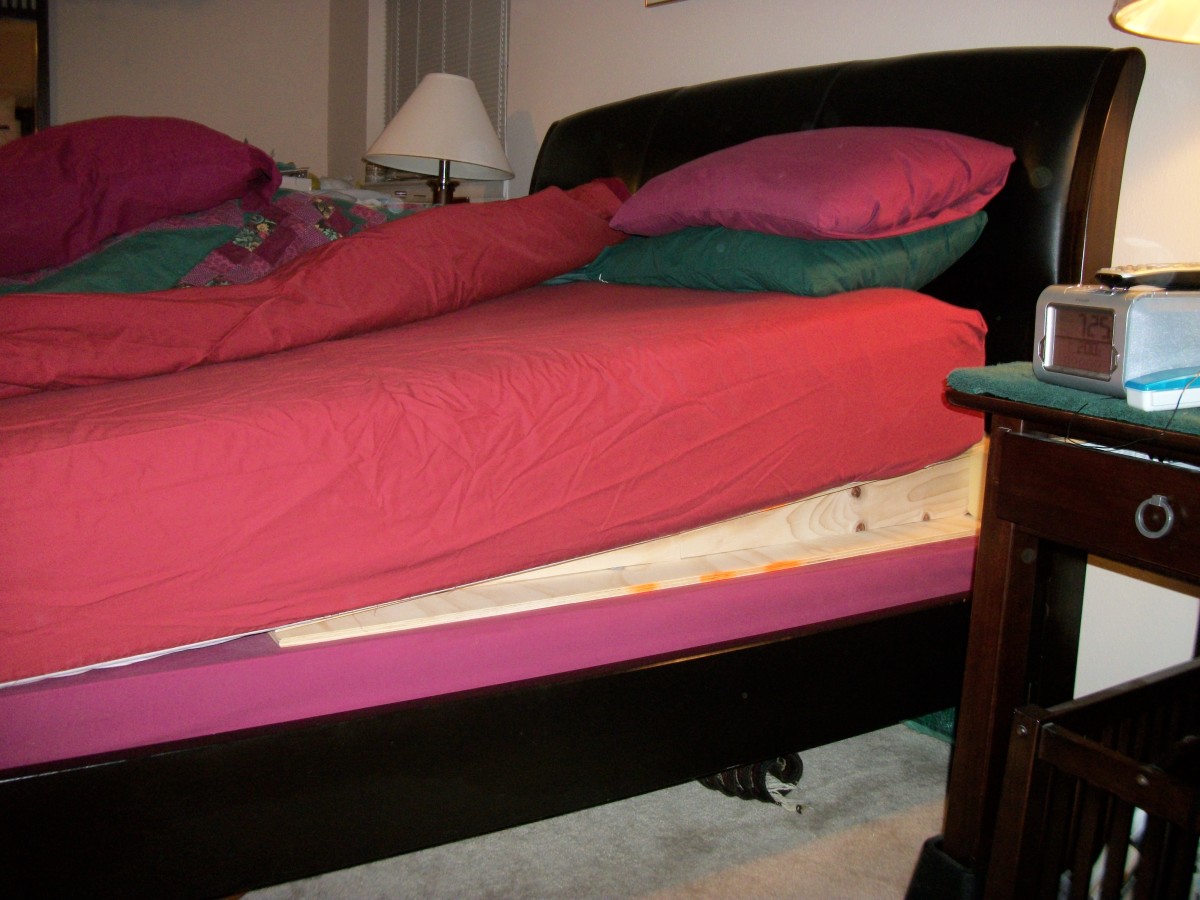 Elevate the head of the bed.  Put a wedge or books between the mattress and springs.