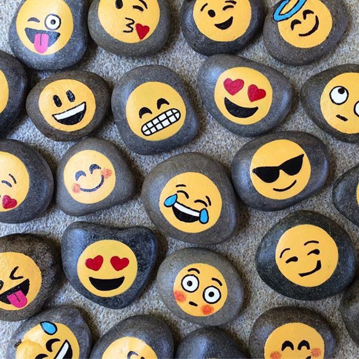 Painting emojis on rocks is just one of many awesome rock painting ideas to try!