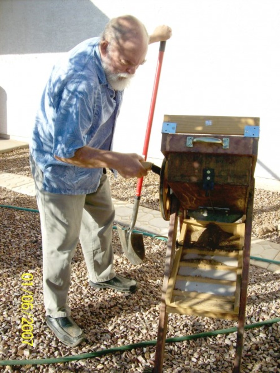 Cranking the bellows and shaking the riffle box.