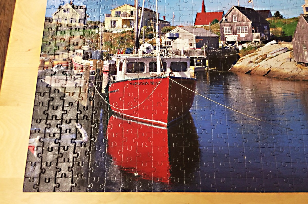 The pieces of this jigsaw puzzle have been glued together, enabling the puzzle to act as a mat on a desk.