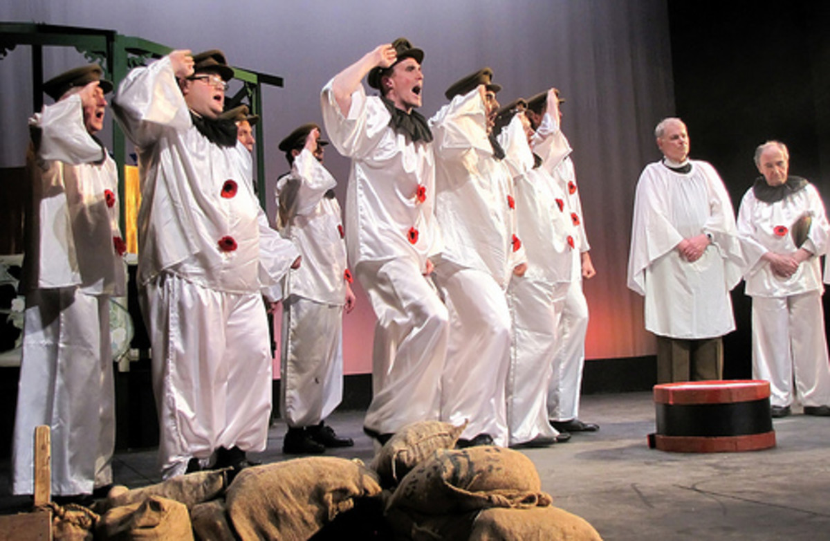 Actors in Pierrot costumes perform a scene from Oh! What a Lovely War.