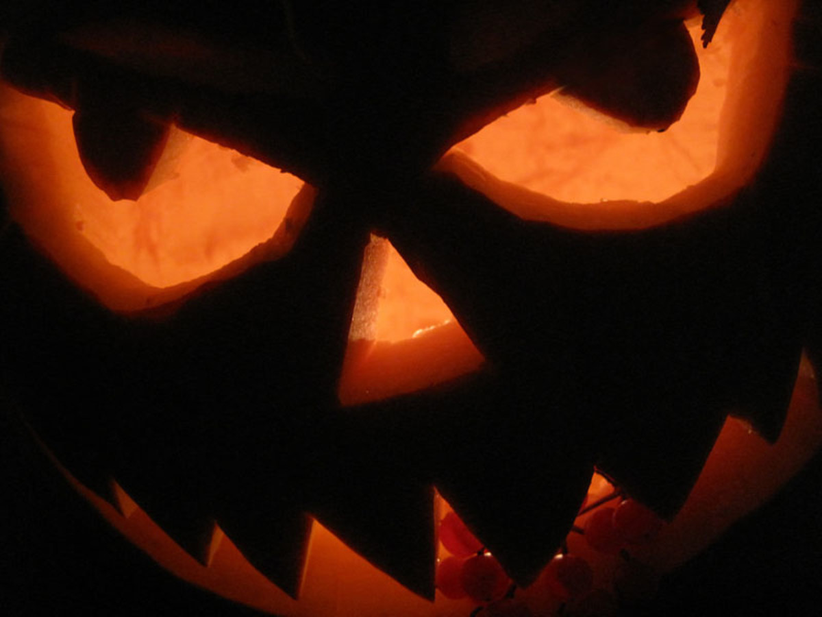 A black, evil pumpkin with an orange glow.