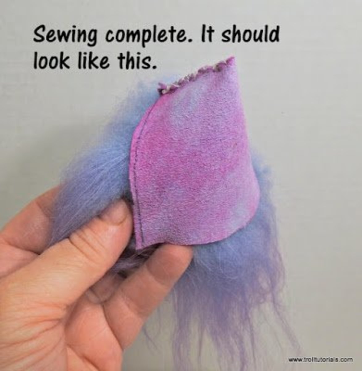 4. When you are done sewing up your troll replacement wig, it should look like this. 