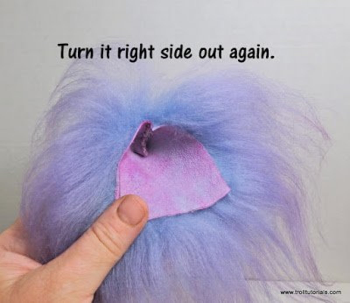 5. Take your troll wig and turn it back the right way so the hair is on the outside. 