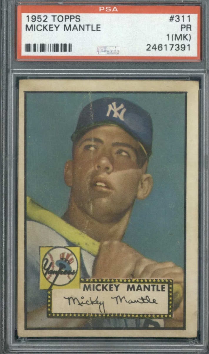 A graded 1952 Topps Mickey Mantle baseball card. In poor condition, the card would command thousands of dollars at auction because it is one of Mantle's rarest cards.