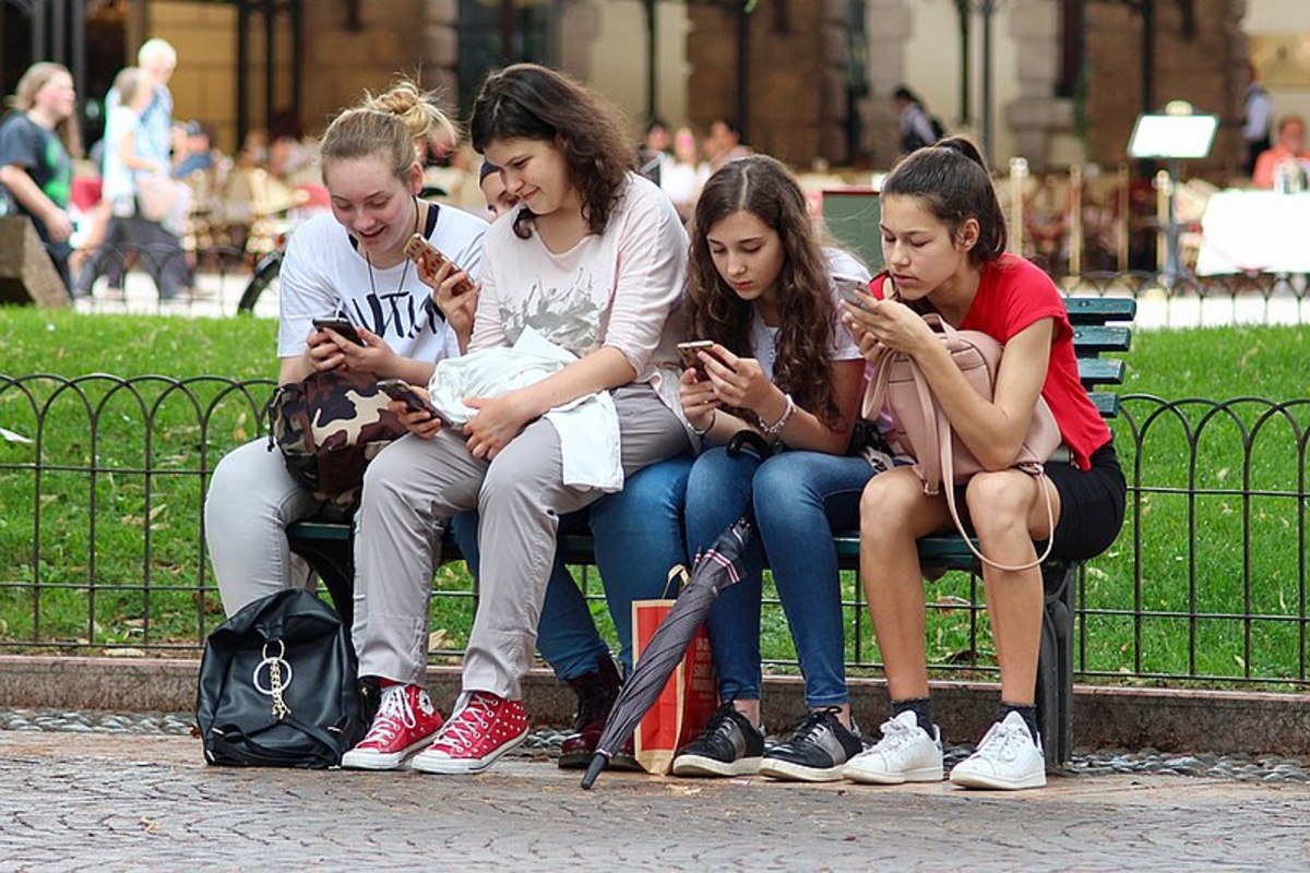 Teenagers Texting on Their Cell Phones