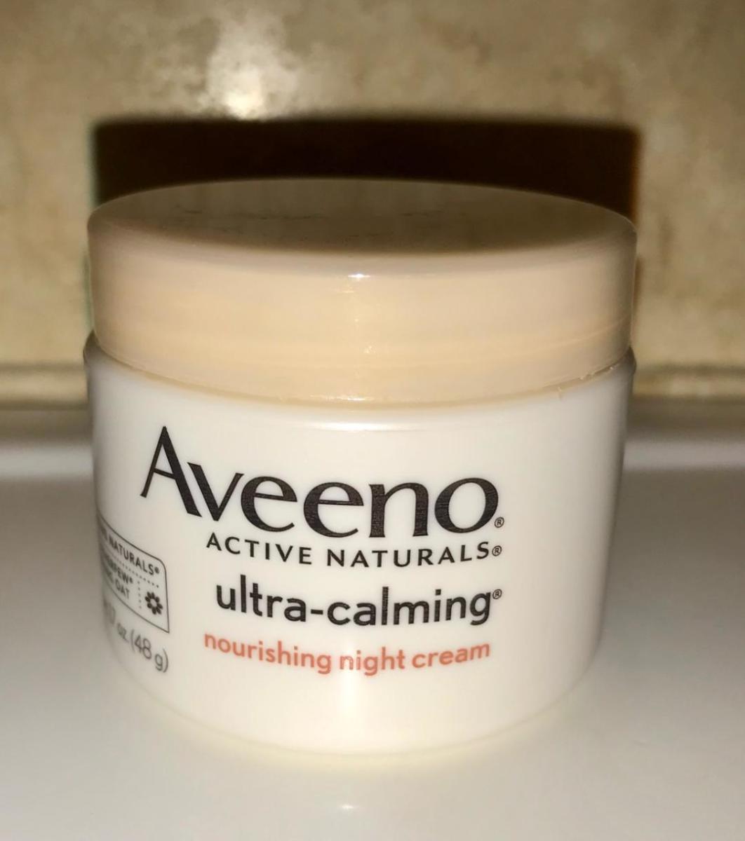 A jar of Aveeno Ultra-Calming Night Cream.