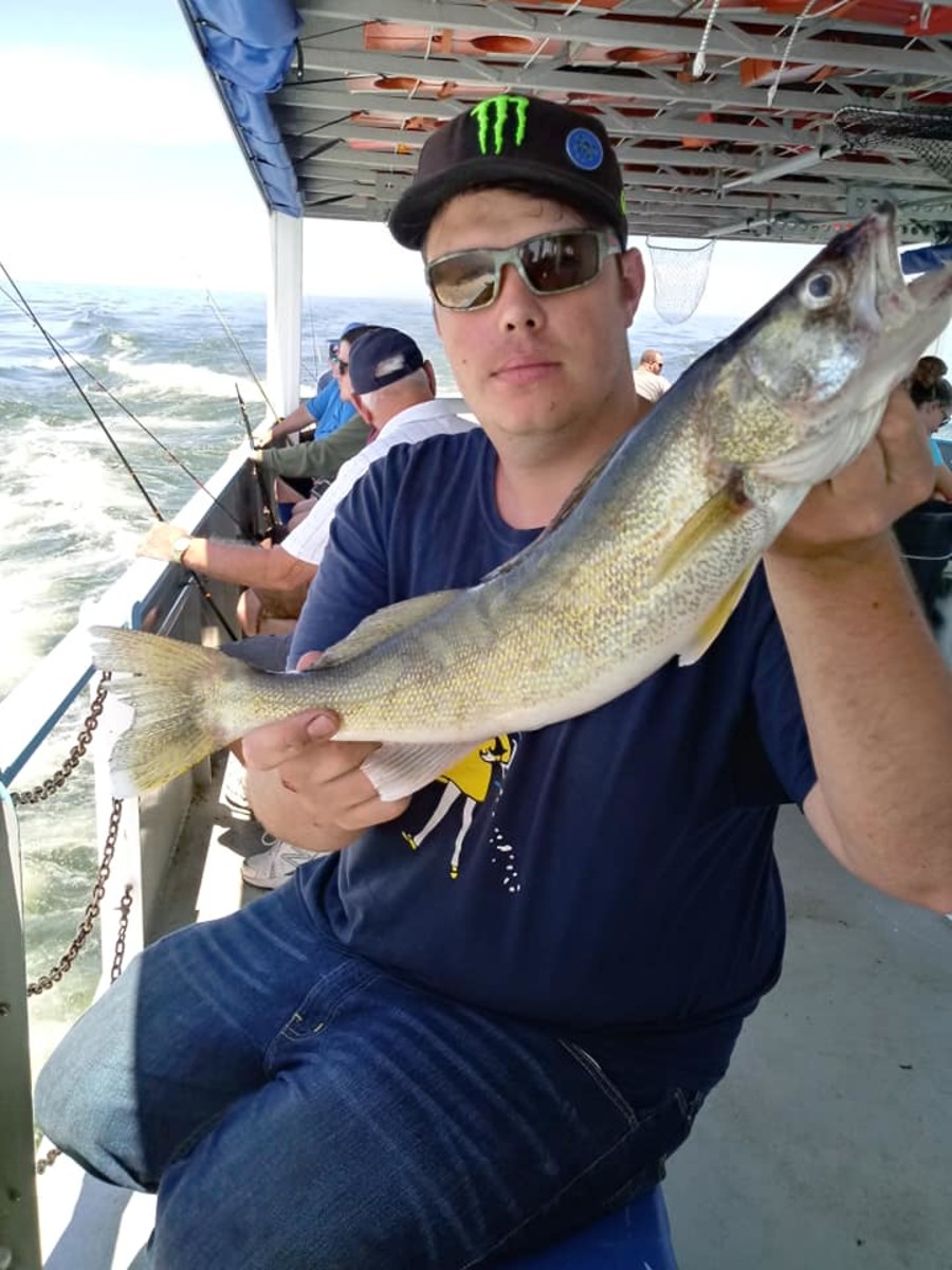 One lucky headboat angler showing off his recent catch, a large female, July 2019.