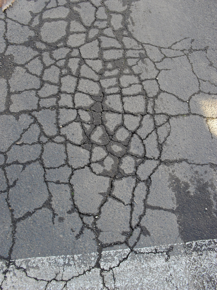 This is an example of deteriorating asphalt. In the 70's as the crude oil shortages spread across America, think tanks began to consider recycling oil-containing asphalt.