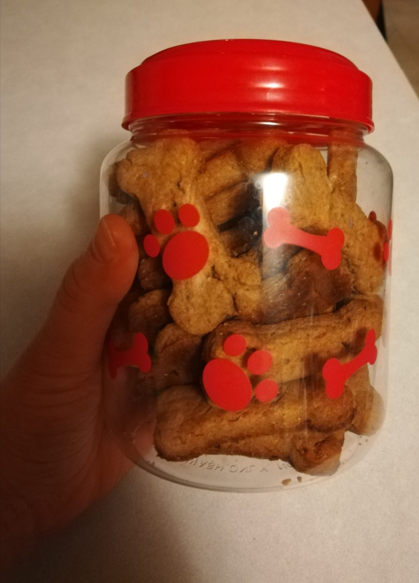 Homemade dog treats in a treat jar from the dollar store.