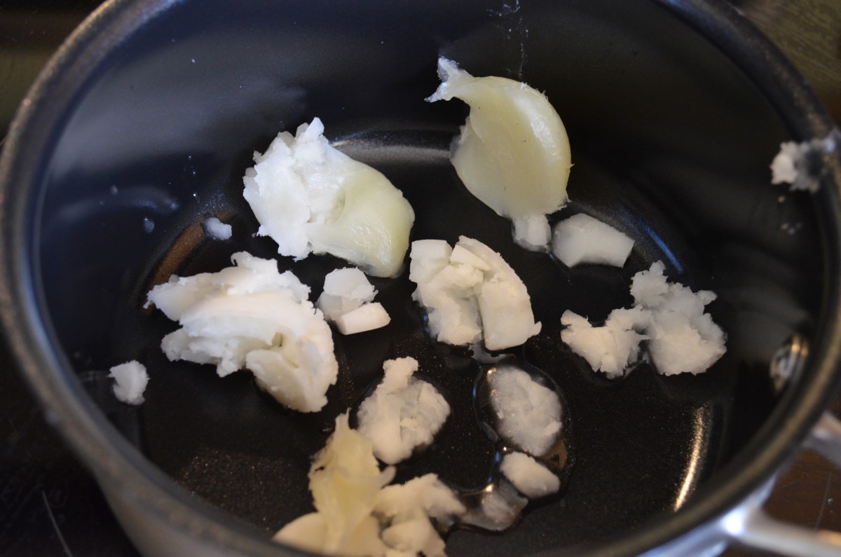 Melt coconut oil and beeswax on very low heat. 