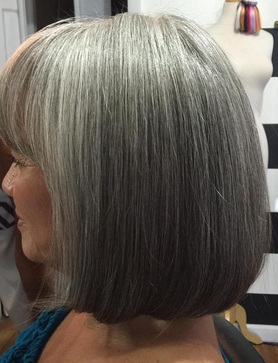 Glassy smooth, long bob is the result of a great cut plus the use of a flatiron. Don't forget the hair serum for that beautiful, reflective shine!