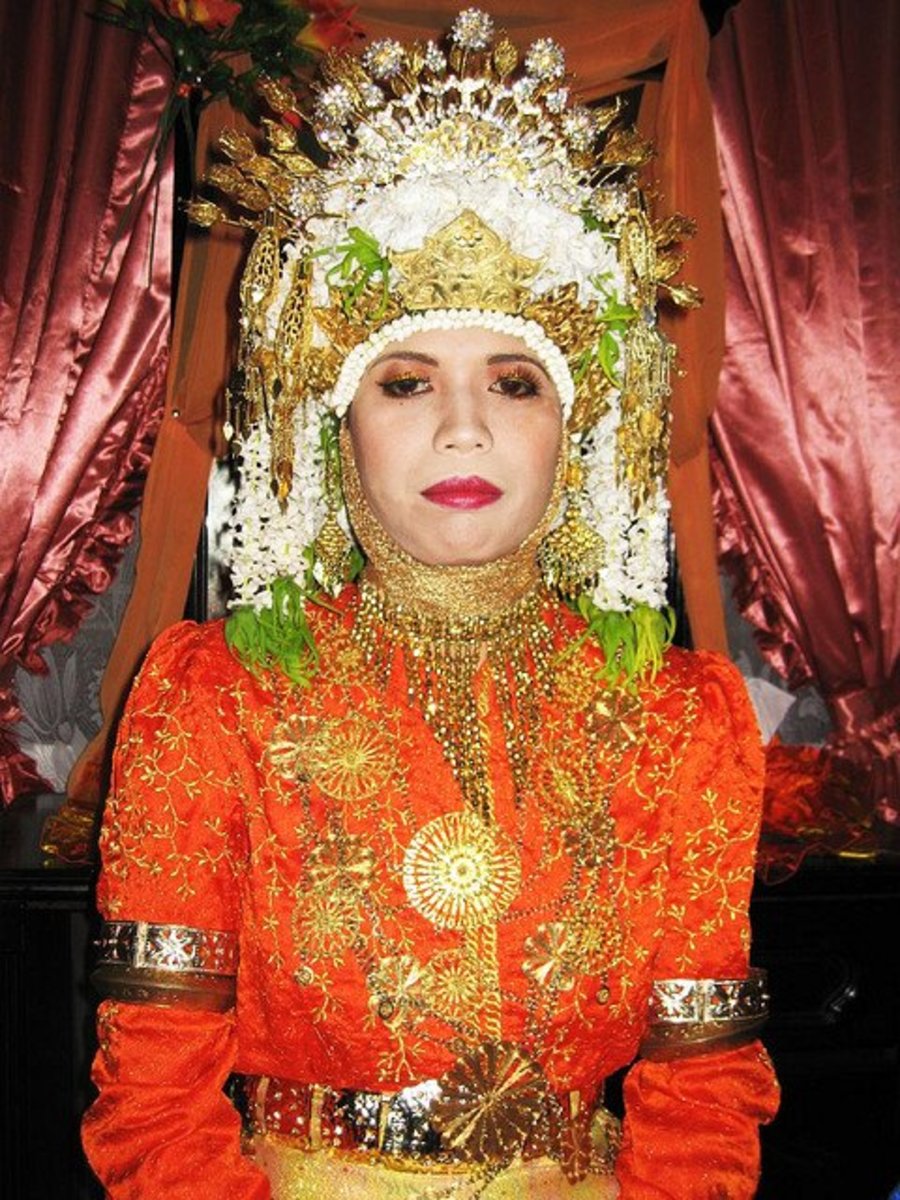 This Acehnese bride is wearing a traditional wedding dress that has probably also been influenced by other regional cultures.