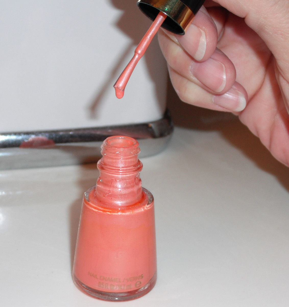 Check the consistency after adding each drop of nail polish thinner.