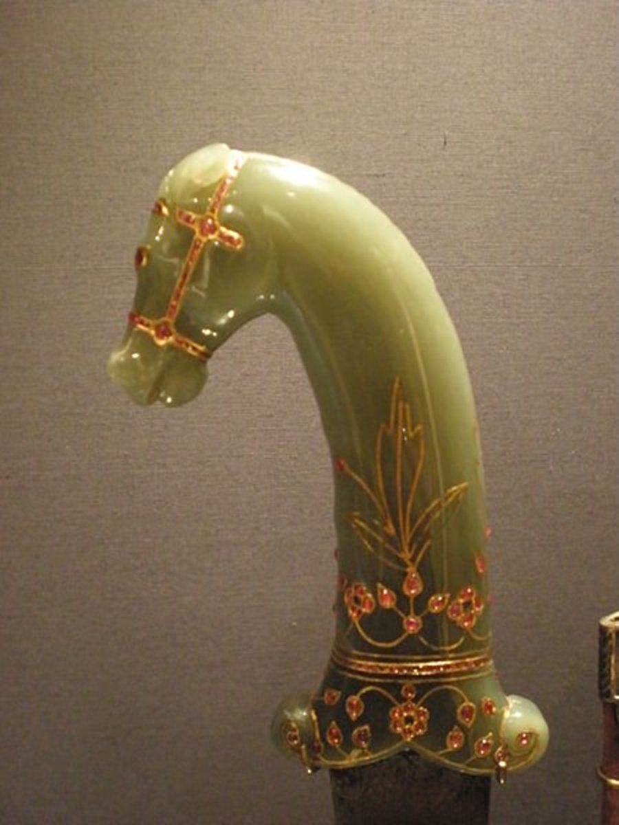  Jade scabbard with gold filigree in the shape of a royal horse