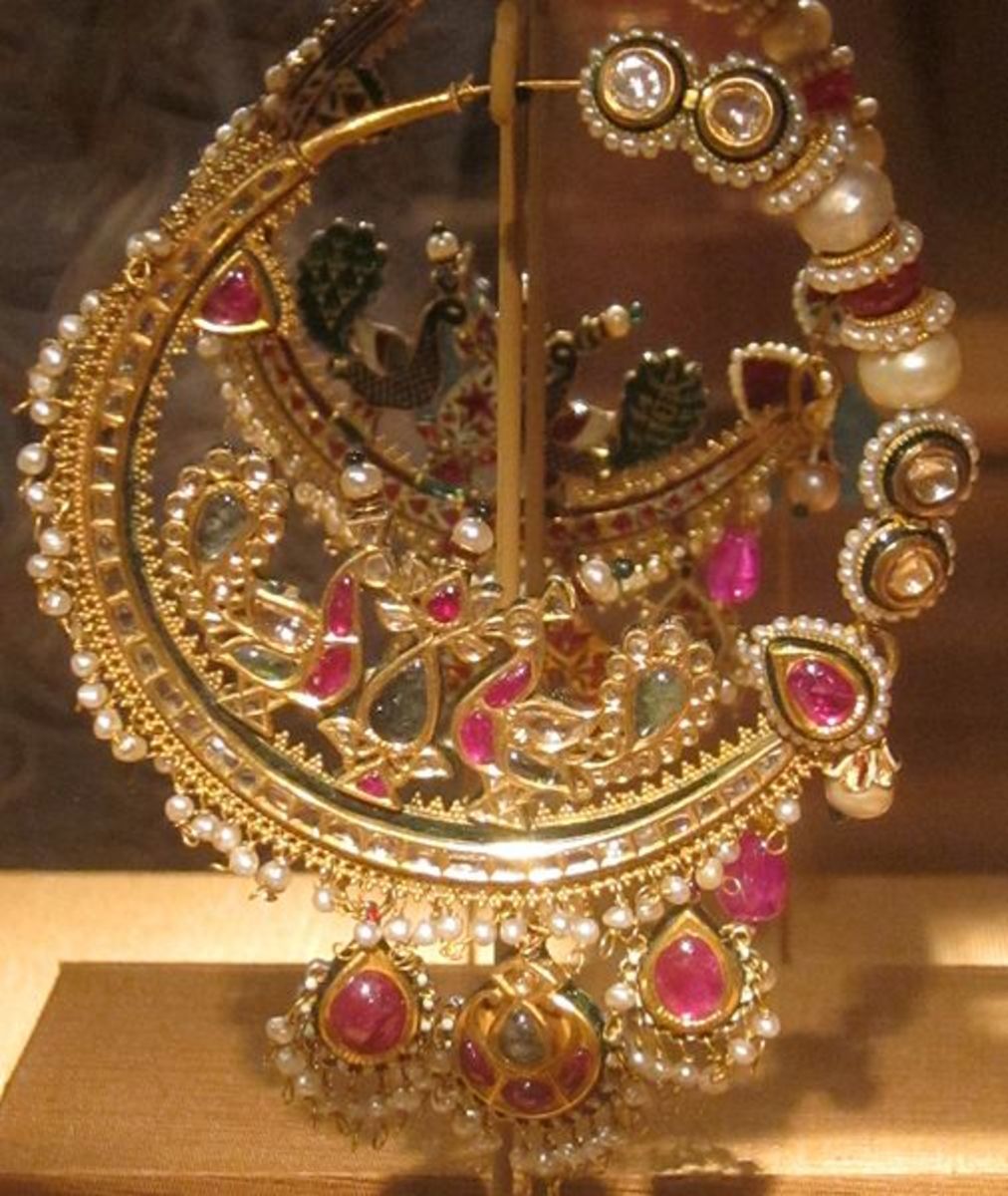 Mughal nose-ring crafted out of gold and studded with various precious gemstones