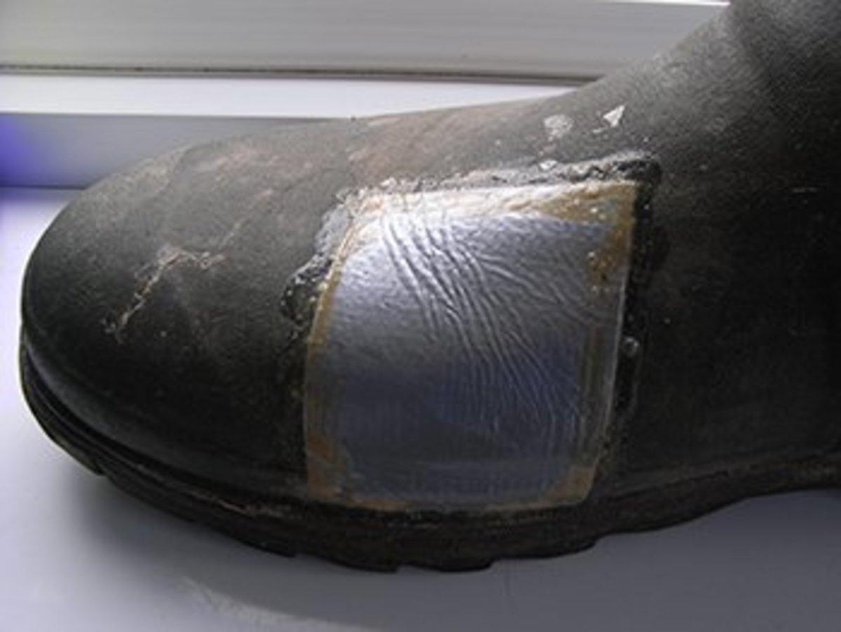 A wellington boot repaired with double-sided tape and gaffer tape. It's a bit rough and ready, but it does the job!