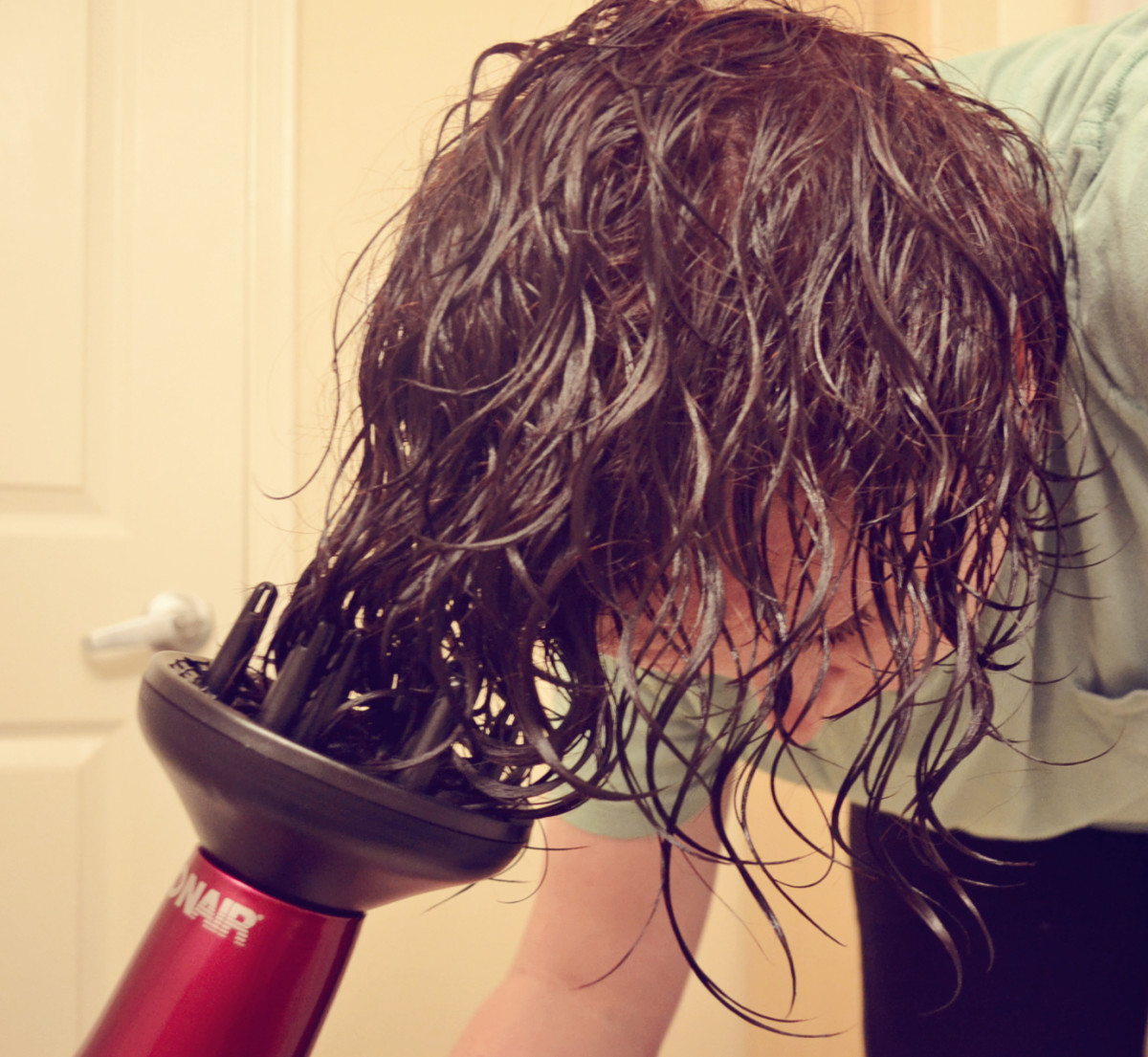 Use a diffuser to gently blow dry your hair, without straightening it.