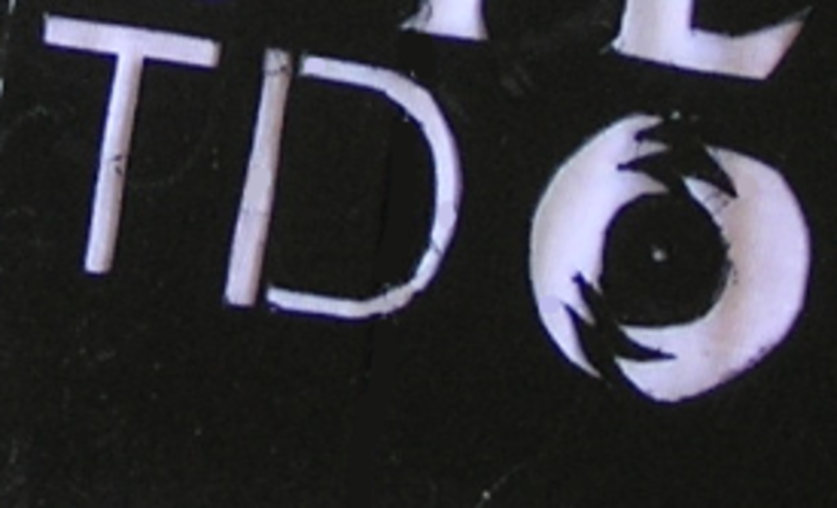 You can see the two points where the inside of the D was connected to the stencil.