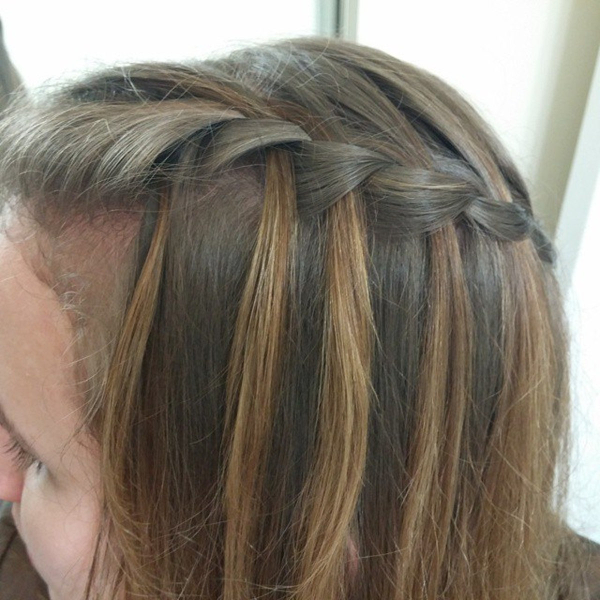 A waterfall braid is a fun twist on a French braid.