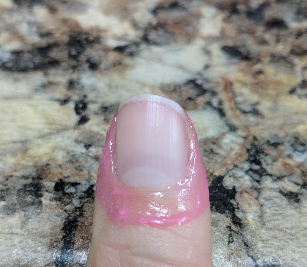 What it looks like after you apply the latex. make sure you apply on your finger tip above the nail too.