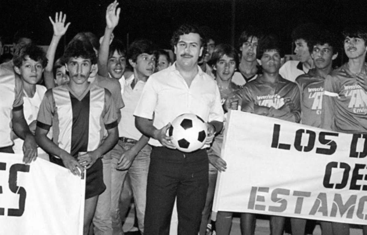 Cocaine kingpin Pablo Escobar with one of his soccer youth clubs, which he sponsored as part of a public relations campaign. At his height, Escobar ran and laundered money through Atletico Nacional, one of the country's premier professional teams.