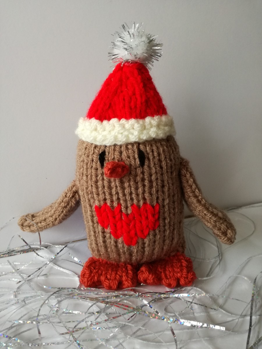 Photo 1. My completed knitted robin doll.