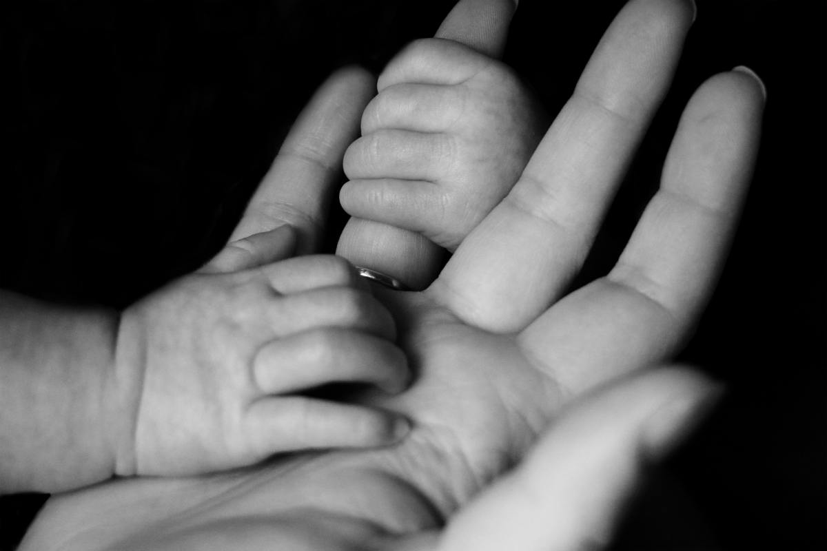 A mother and baby's hands
