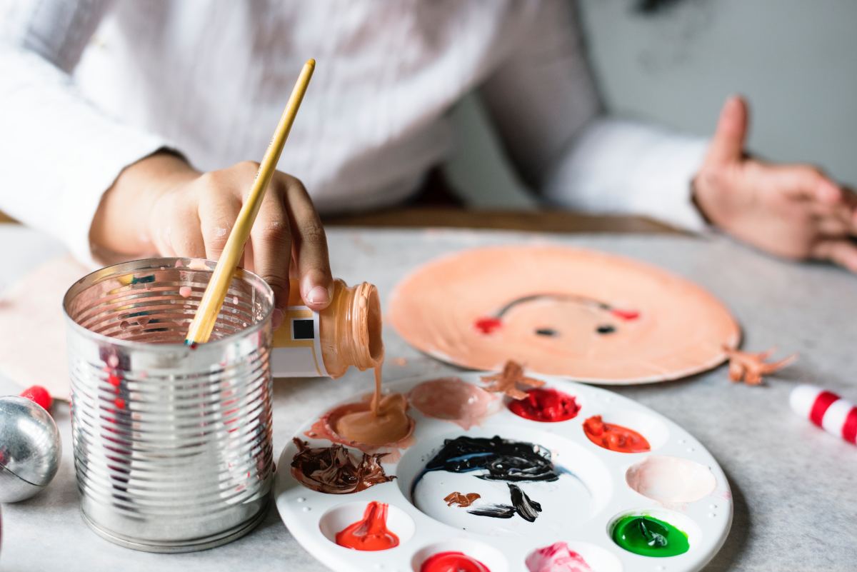 Painting lets a 3 year old express their creativity.