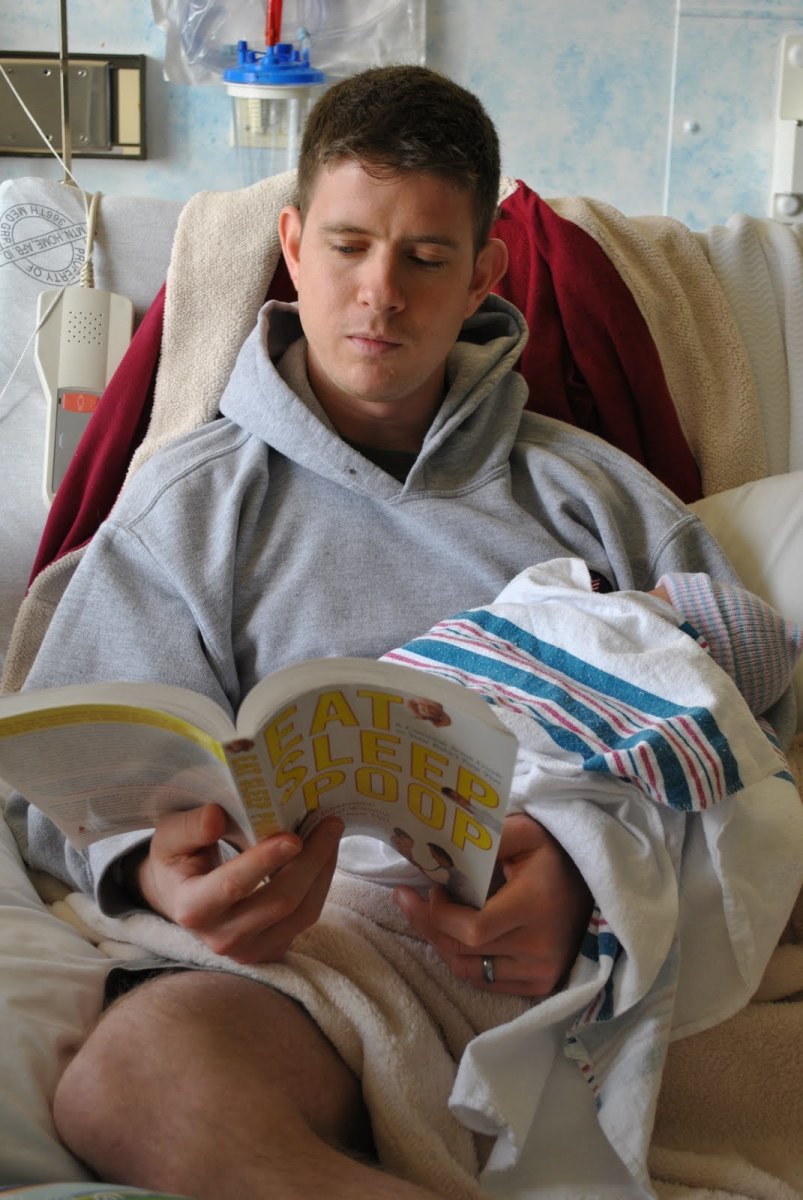 My husband reading to our newborn son while we were still in the hospital! 