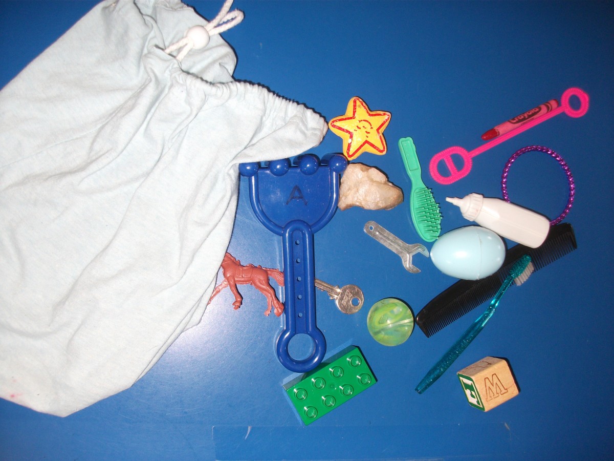 The kids feel the objects in the bag without looking.