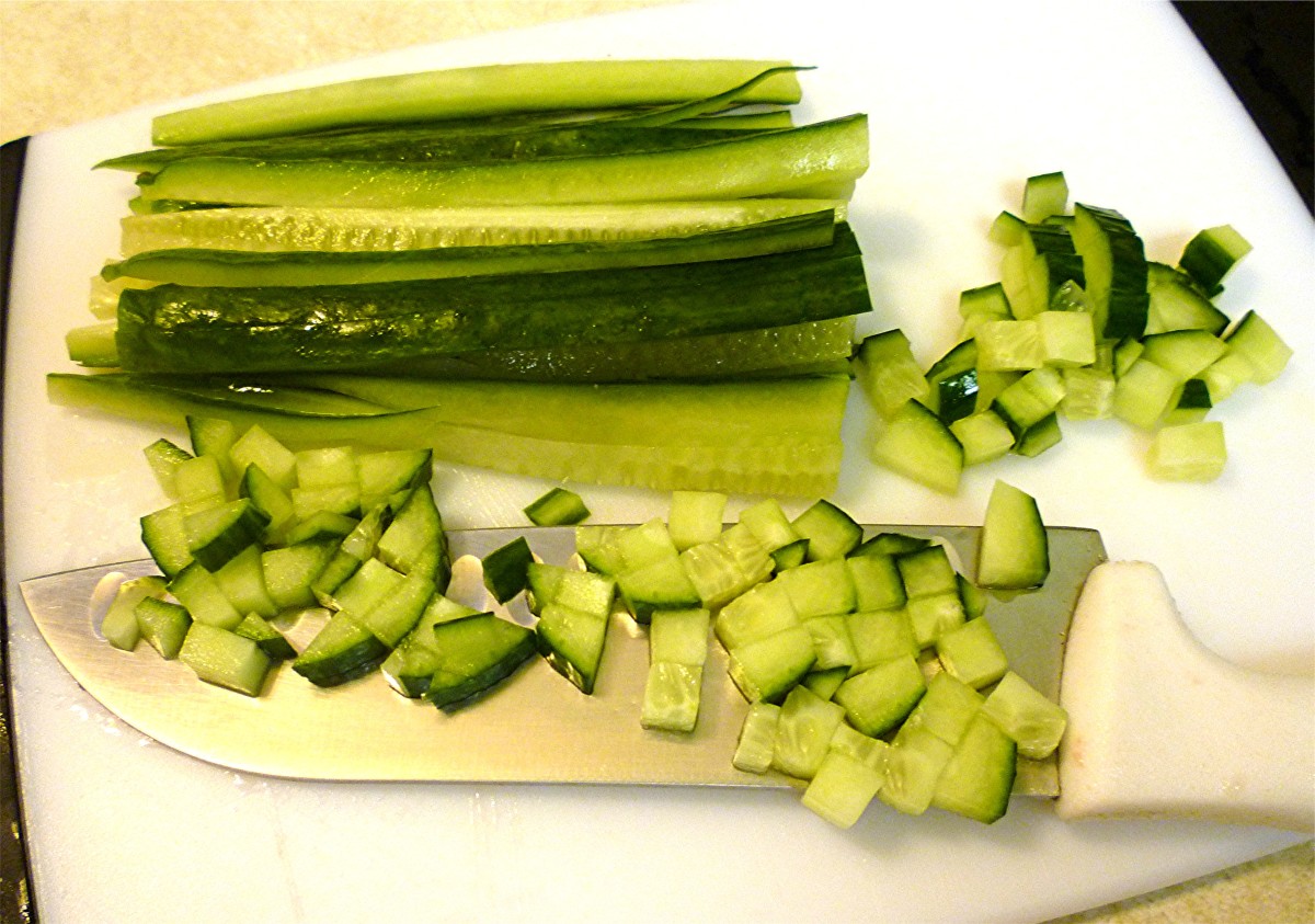 English cucumber being cut up for Gazpacho 
