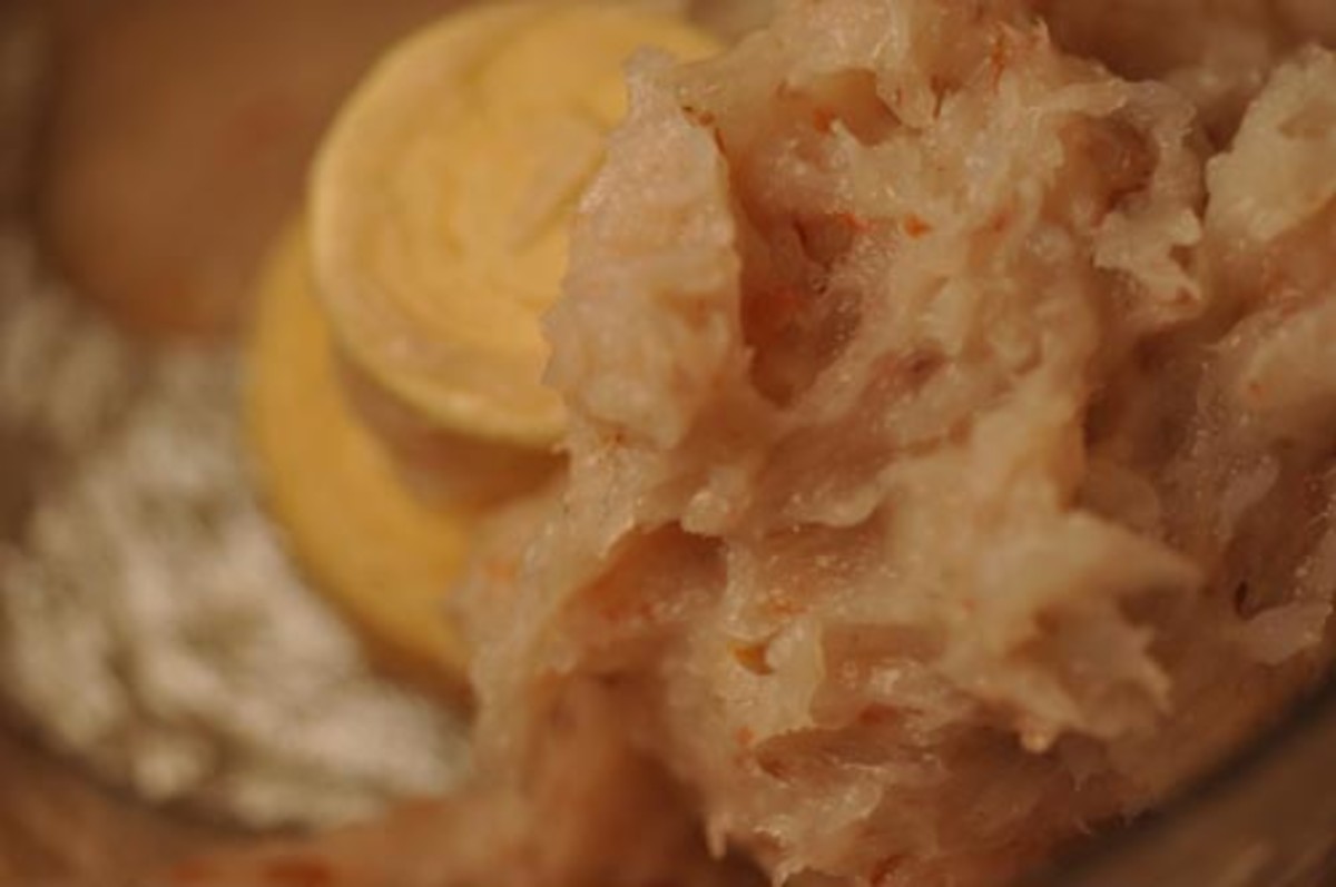 Grind prawn meat to fine paste. 
